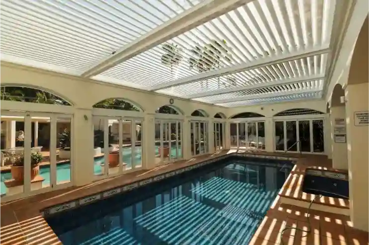 Louvred pool enclosure in a multi-unit development
