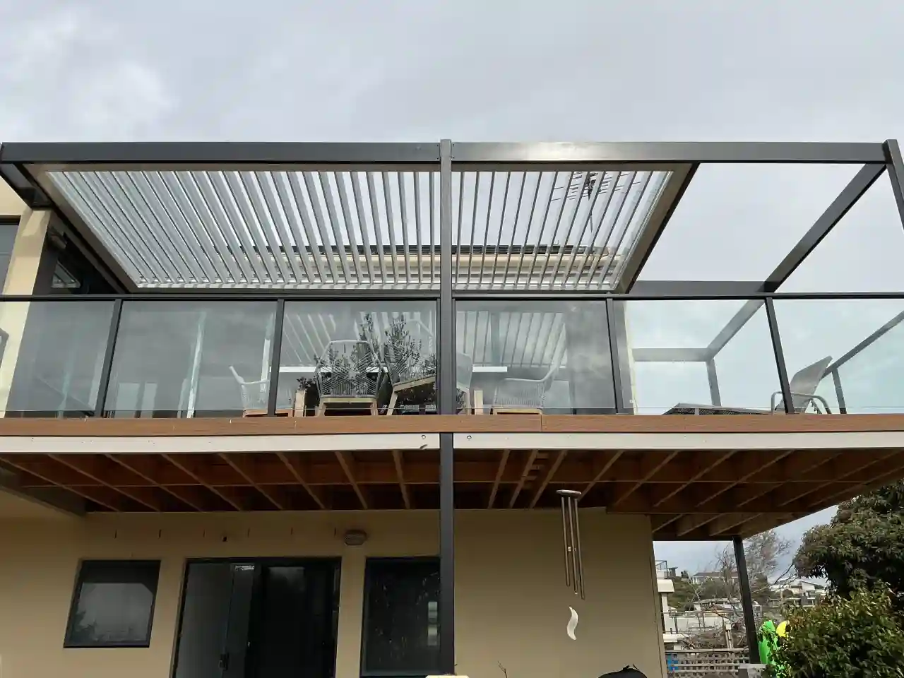 A recently designed and constructed 2nd storey louvred pergola completed by our Melbourne outdoor roofing team in Frankston.